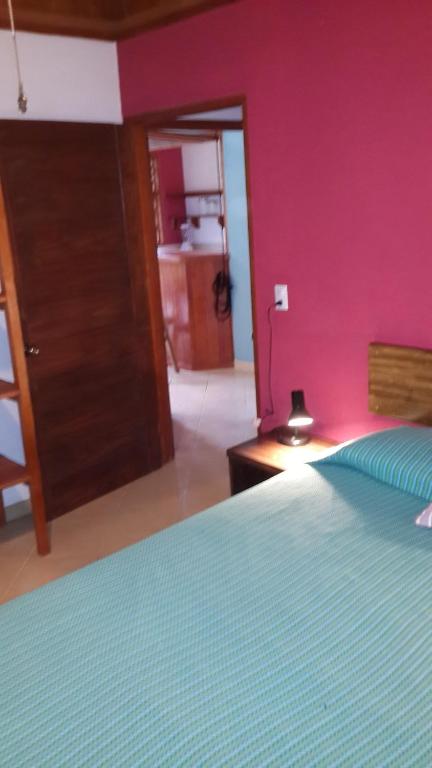 Postel nebo postele na pokoji v ubytování Los Delfines Lodge
