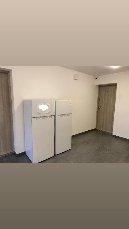 Kuchyň nebo kuchyňský kout v ubytování Roomflacja