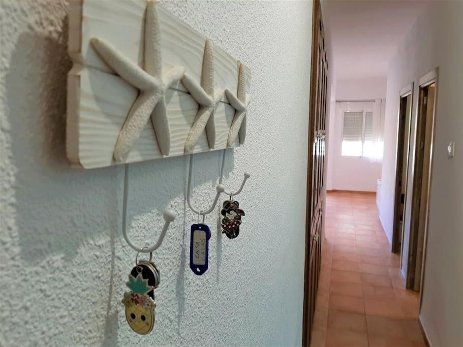 a room with a hallway with pillows on a wall at Apartamento Calypso in Cabo de Palos