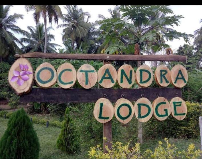 a sign for a oondaodoodoodoodoodo office at Octandra Lodge in Suriyawewa