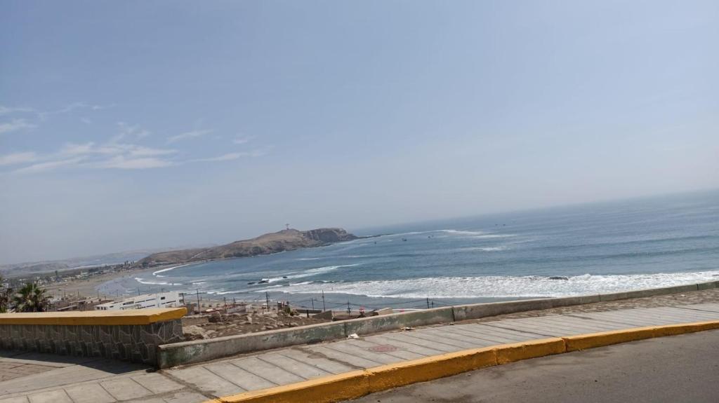 a view of a beach and the ocean at HOTEL G&EMP Rador BARRANCA in Barranca