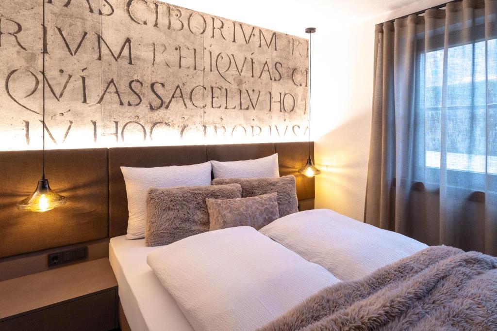Postel nebo postele na pokoji v ubytování Chalet ORUS - Tirol Kärnten