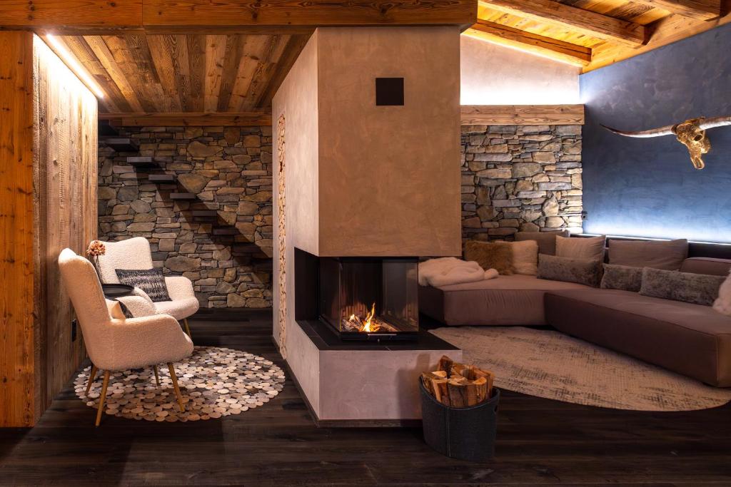 Posezení v ubytování Chalet ORUS - Tirol Kärnten
