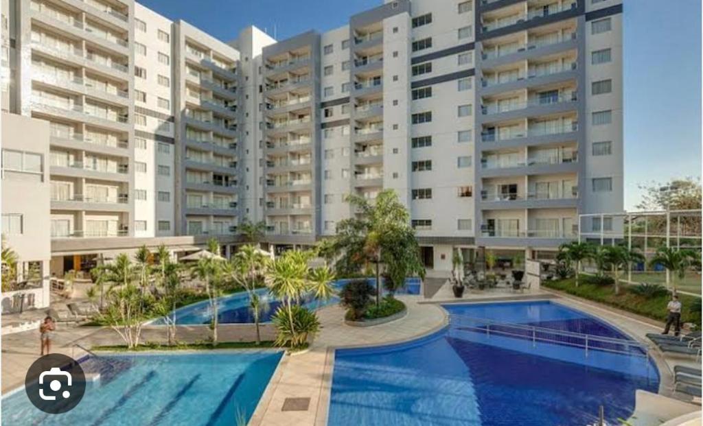 an image of an apartment complex with a swimming pool at Veredas do Rio Quente 116 in Rio Quente