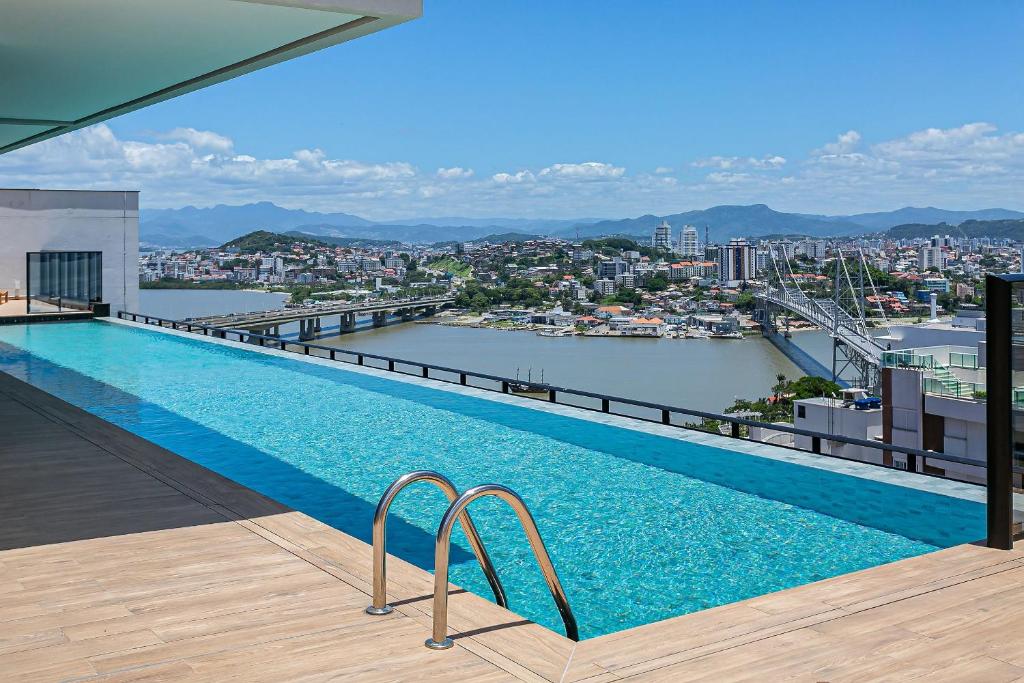 a swimming pool on the roof of a building at Wi-Fi 250MB | Sea View | Pool #CA61 in Florianópolis