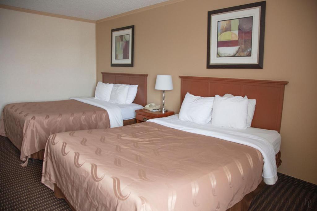 Postel nebo postele na pokoji v ubytování All Stay Suites