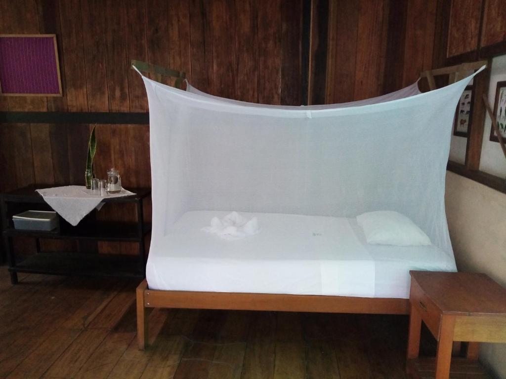 Postel nebo postele na pokoji v ubytování Inotawa Lodge