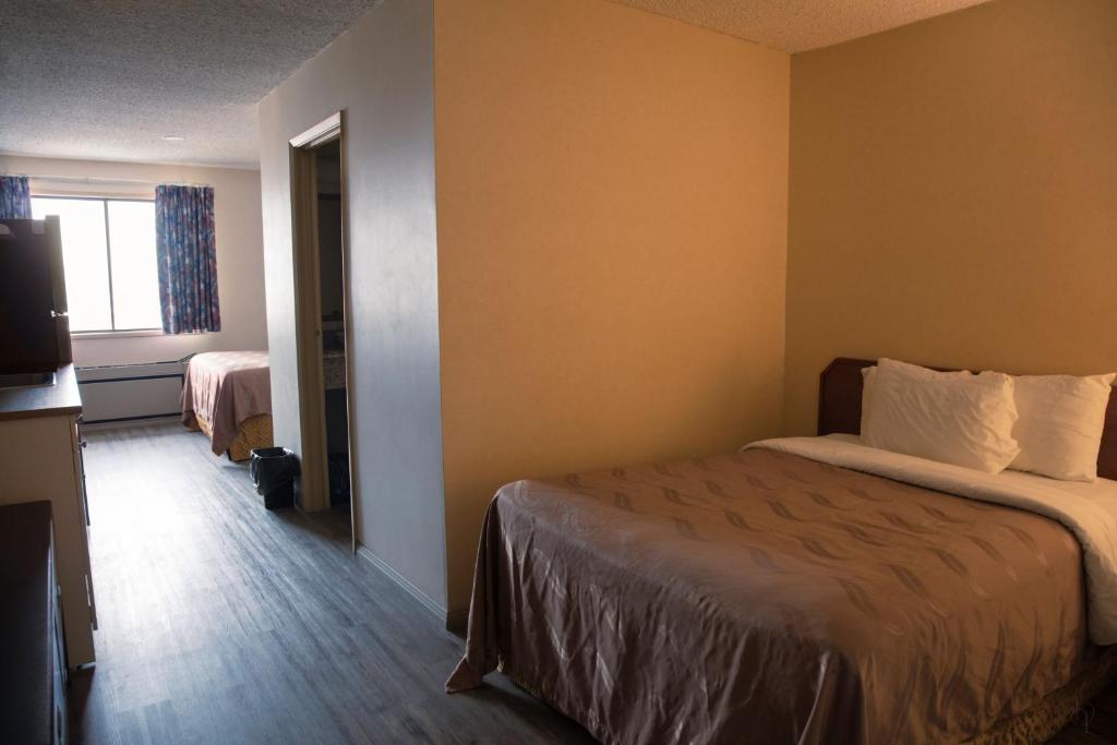 Postel nebo postele na pokoji v ubytování All Stay Suites