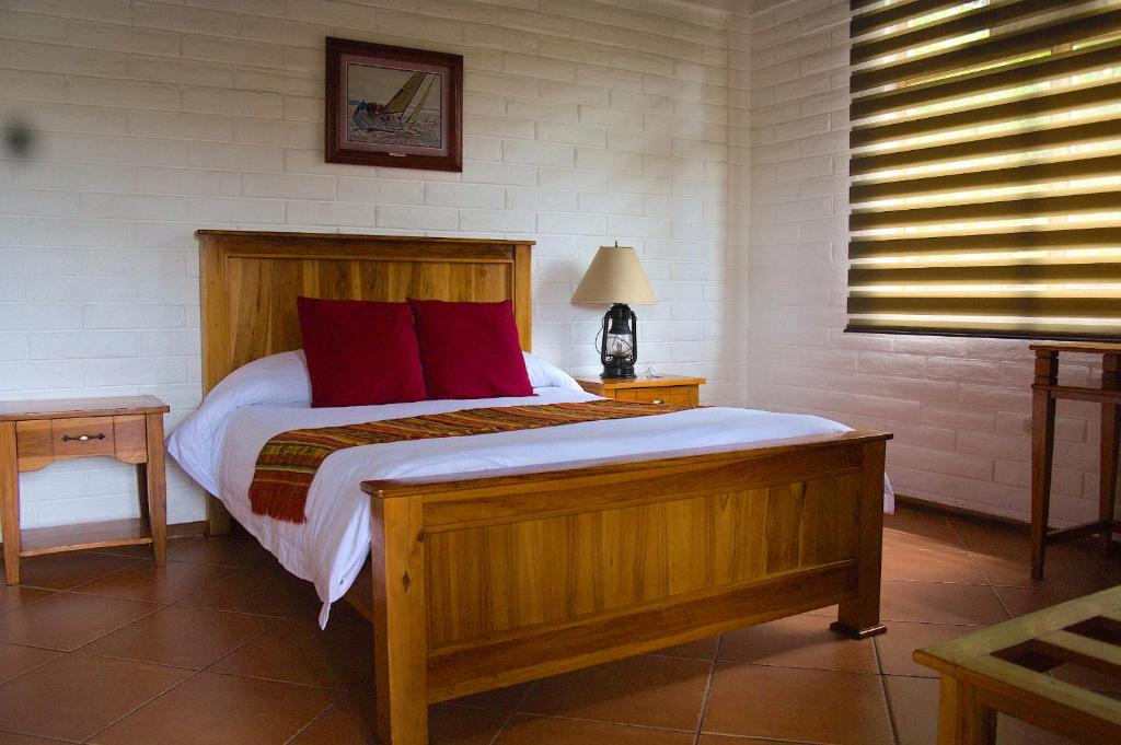 Postel nebo postele na pokoji v ubytování Hosteria Cananvalle