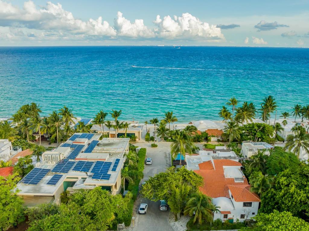 an aerial view of a resort and the ocean at Villas Xaguar by PlayaSky in Playa del Carmen