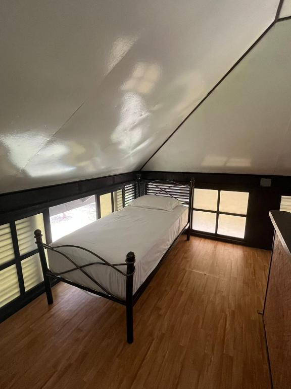 Letto o letti in una camera di Pension Hibiscus Taha'a