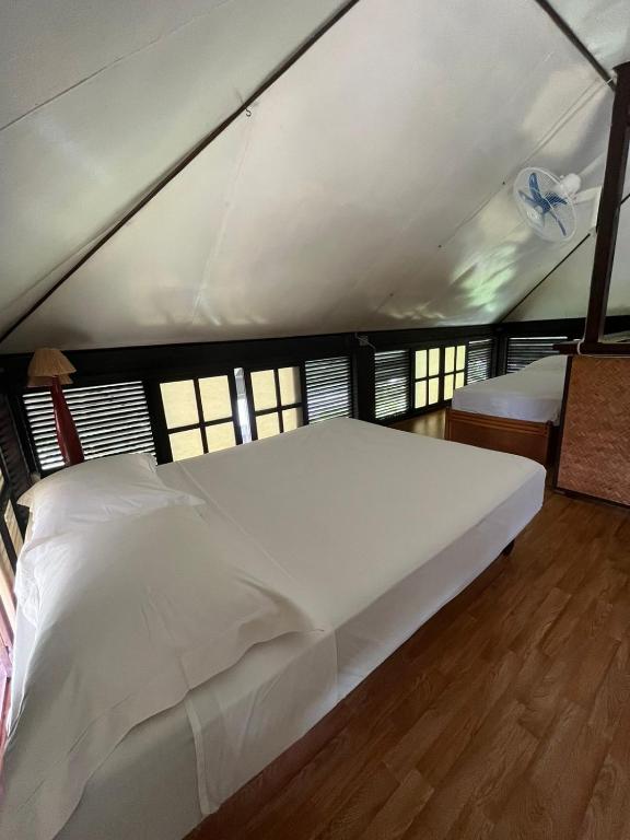 Letto o letti in una camera di Pension Hibiscus Taha'a