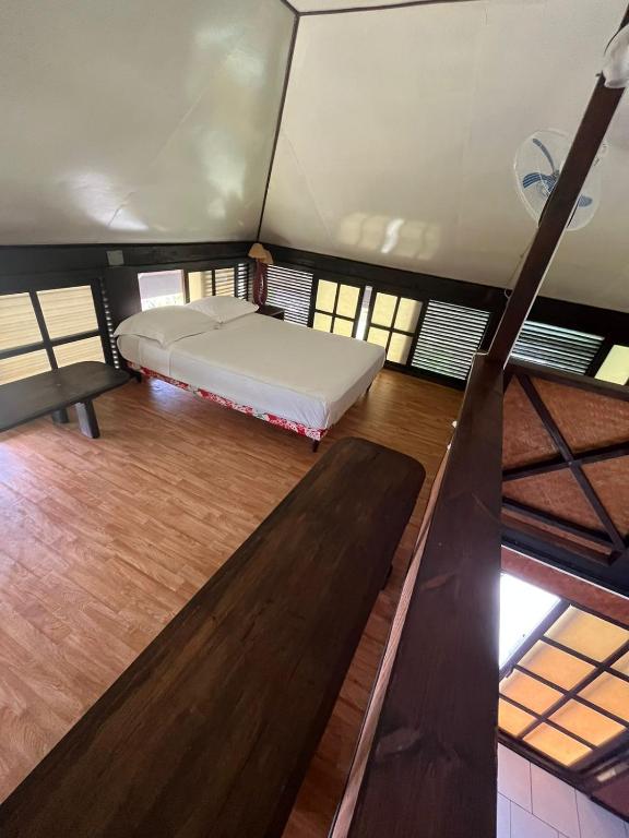 Letto o letti in una camera di Pension Hibiscus Taha'a