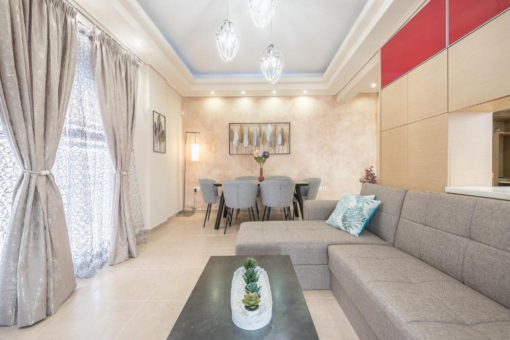 a living room with a couch and a table at Myilios Luxury Petralona Athens Center in Athens