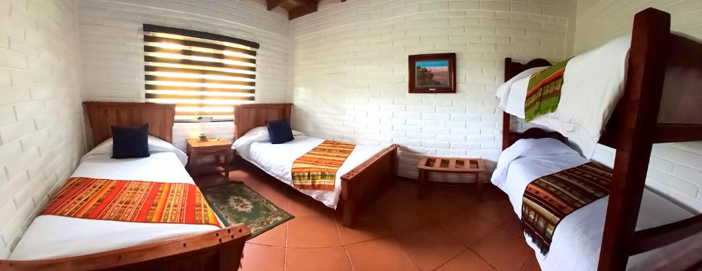 Postel nebo postele na pokoji v ubytování Hosteria Cananvalle