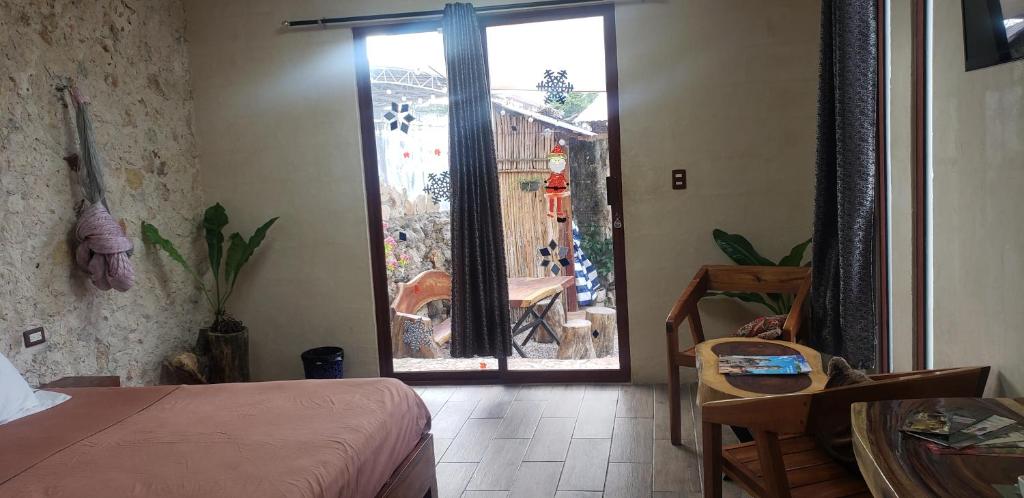 Postel nebo postele na pokoji v ubytování Casa los Jarochos