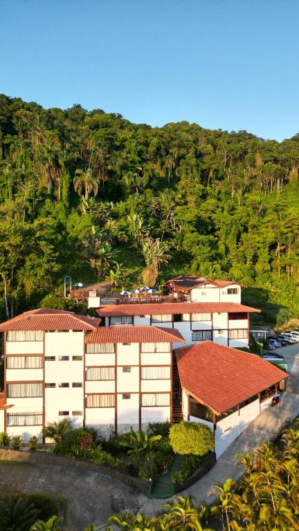 an overhead view of a building with a red roof at Hotel Coquille in Ubatuba