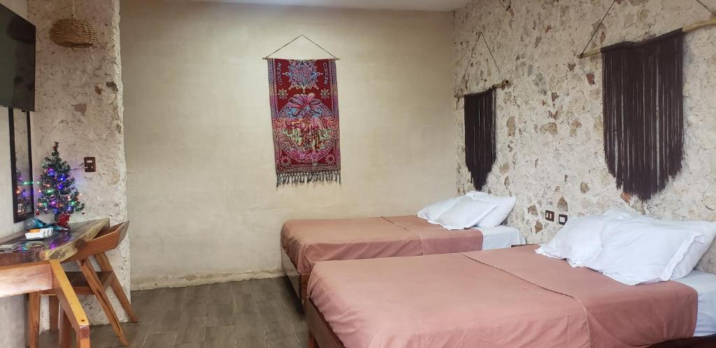 Postel nebo postele na pokoji v ubytování Casa los Jarochos