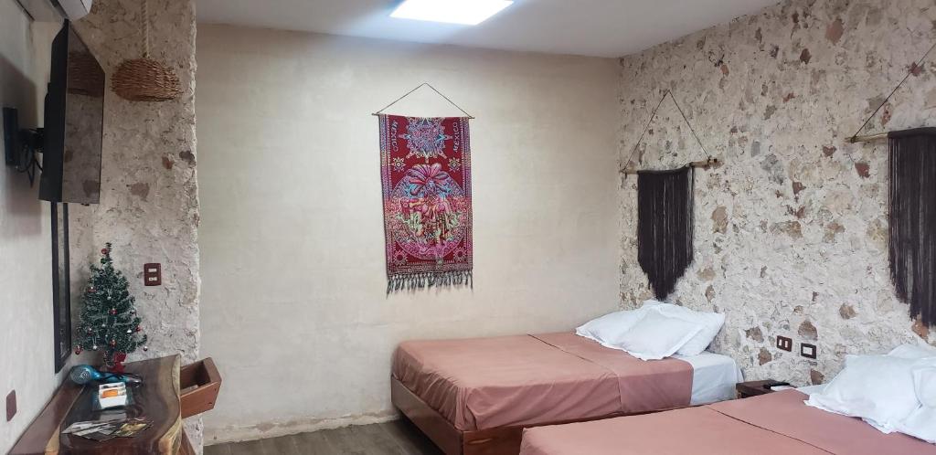 Postel nebo postele na pokoji v ubytování Casa los Jarochos
