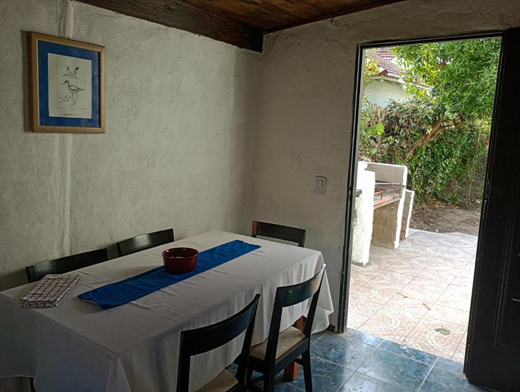 a table with a blue napkin on top of it at Casa tipo cabaña El Faro (con seña) in Mar del Plata