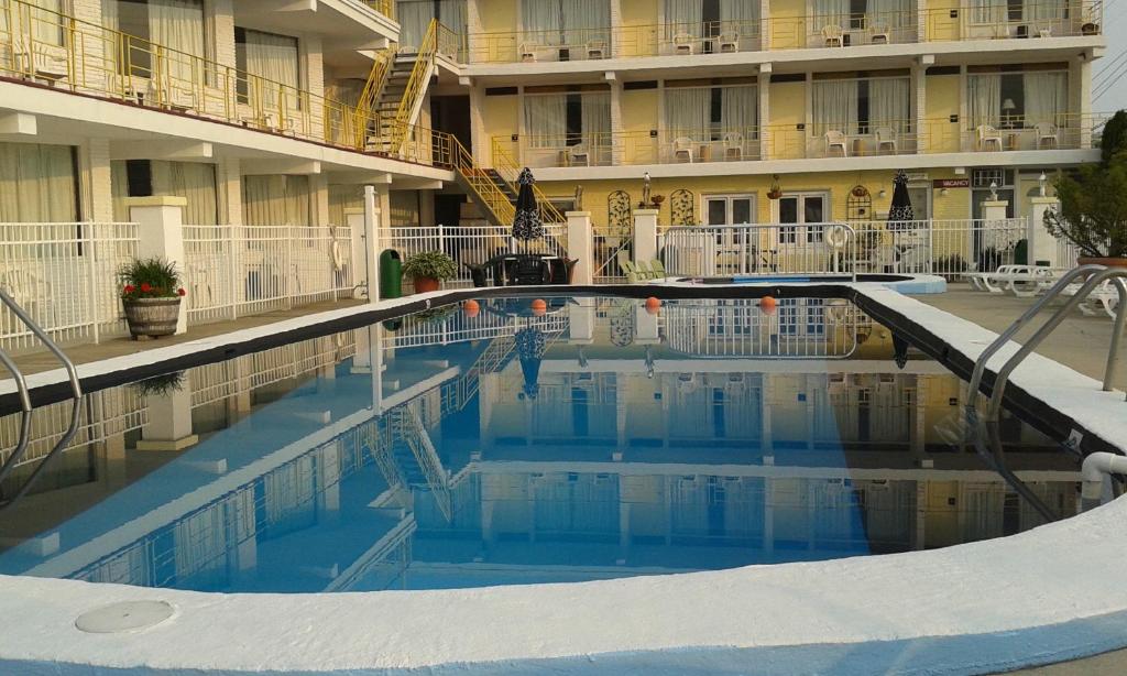 a swimming pool in front of a hotel at Viking Motel in Wildwood Crest