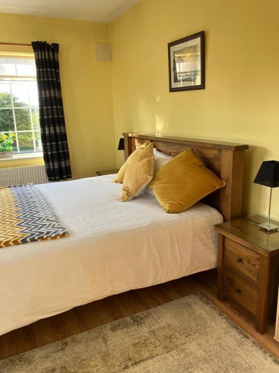 Postel nebo postele na pokoji v ubytování Oakwood B&B