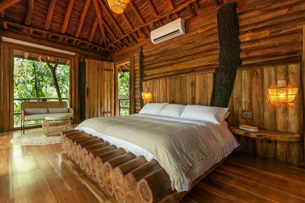 Postel nebo postele na pokoji v ubytování Hotel Boutique Maitta en Doradal Antioquia
