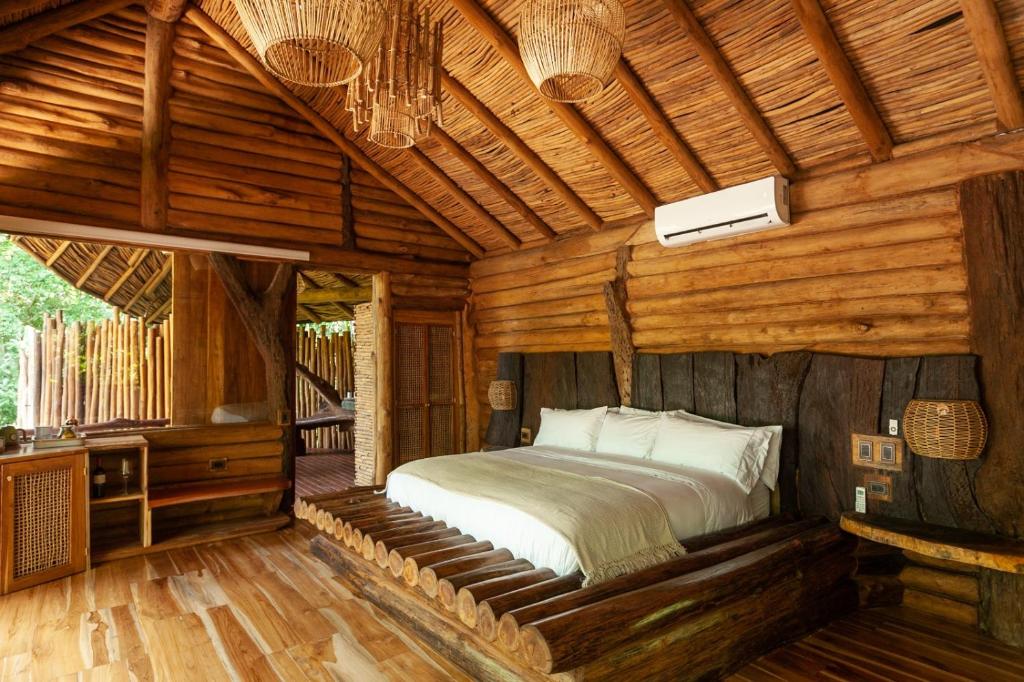 Postel nebo postele na pokoji v ubytování Hotel Boutique Maitta en Doradal Antioquia