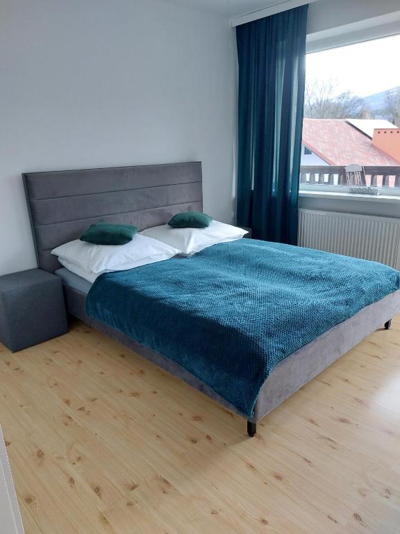 Postel nebo postele na pokoji v ubytování Willa KaMa