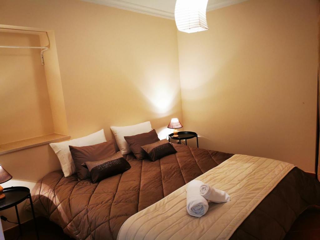 מיטה או מיטות בחדר ב-Casa dos Carvalhinhos