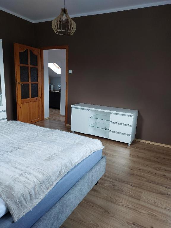 Postel nebo postele na pokoji v ubytování Willa KaMa