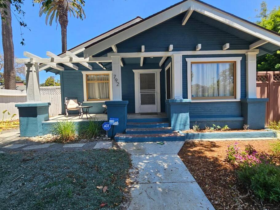 a blue house with a pergola at Entire home in Historic Long Beach close to shops in Long Beach