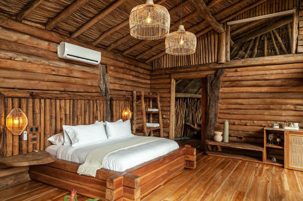 Postel nebo postele na pokoji v ubytování Hotel Boutique Maitta en Doradal Antioquia