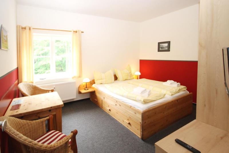 מיטה או מיטות בחדר ב-Mollibahnhof - Heiligendamm Mollibahnhof Heiligendamm DZ 04