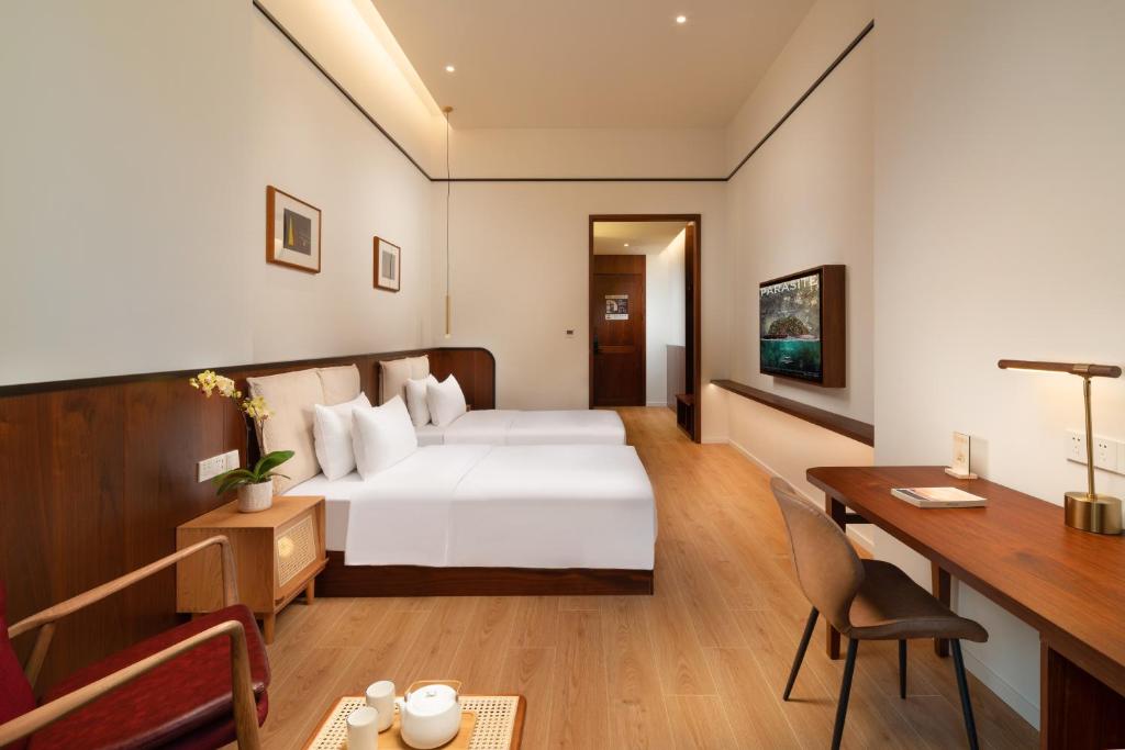 Katil atau katil-katil dalam bilik di Wuyu Hotel, Smart Park & Happy Valley Jinshansi Metro