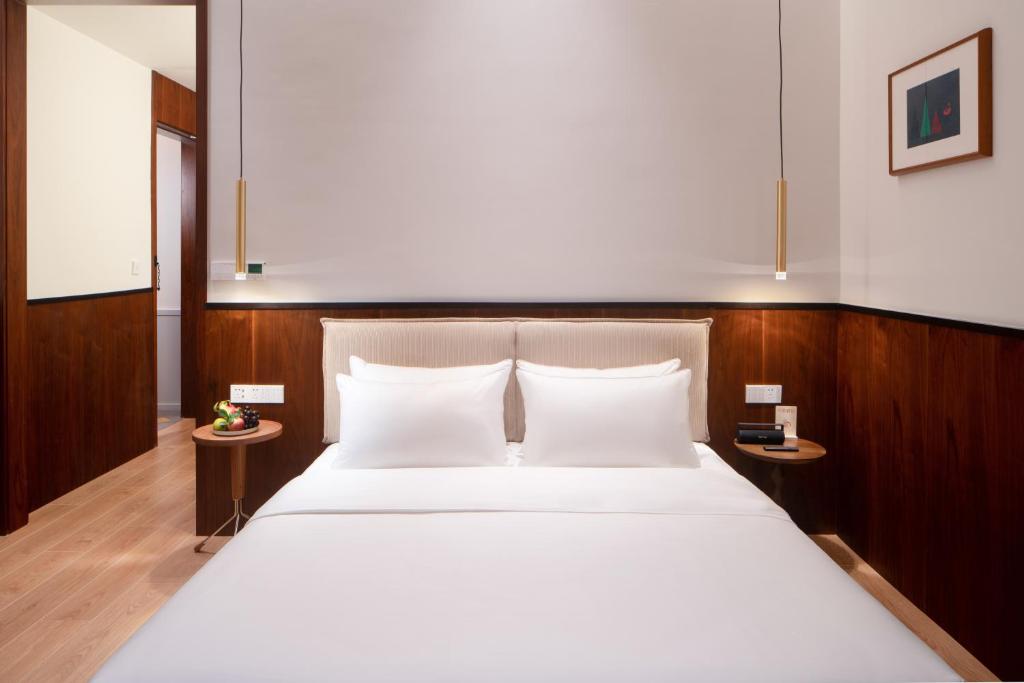 Katil atau katil-katil dalam bilik di Wuyu Hotel, Smart Park & Happy Valley Jinshansi Metro