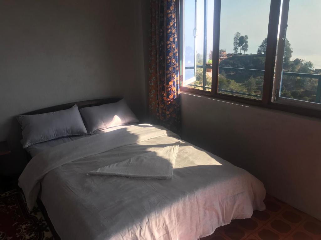Postel nebo postele na pokoji v ubytování Sunrise Point Homestay