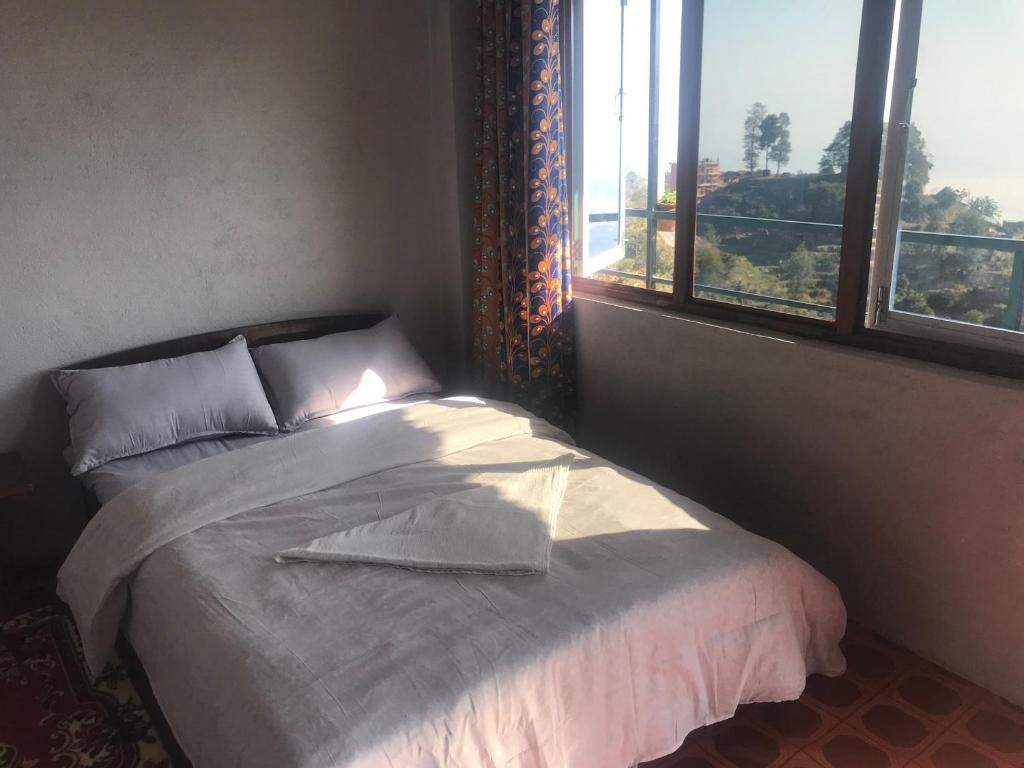 Postel nebo postele na pokoji v ubytování Sunrise Point Homestay