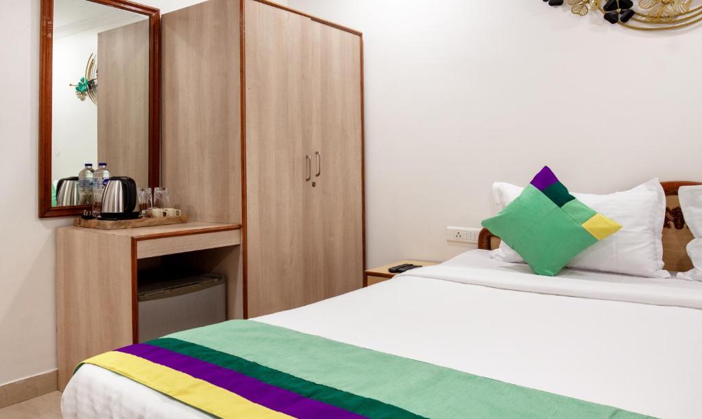 Postel nebo postele na pokoji v ubytování Treebo Y Hotels Elite, Khandagiri