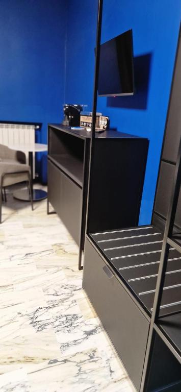TV a/nebo společenská místnost v ubytování Blu room