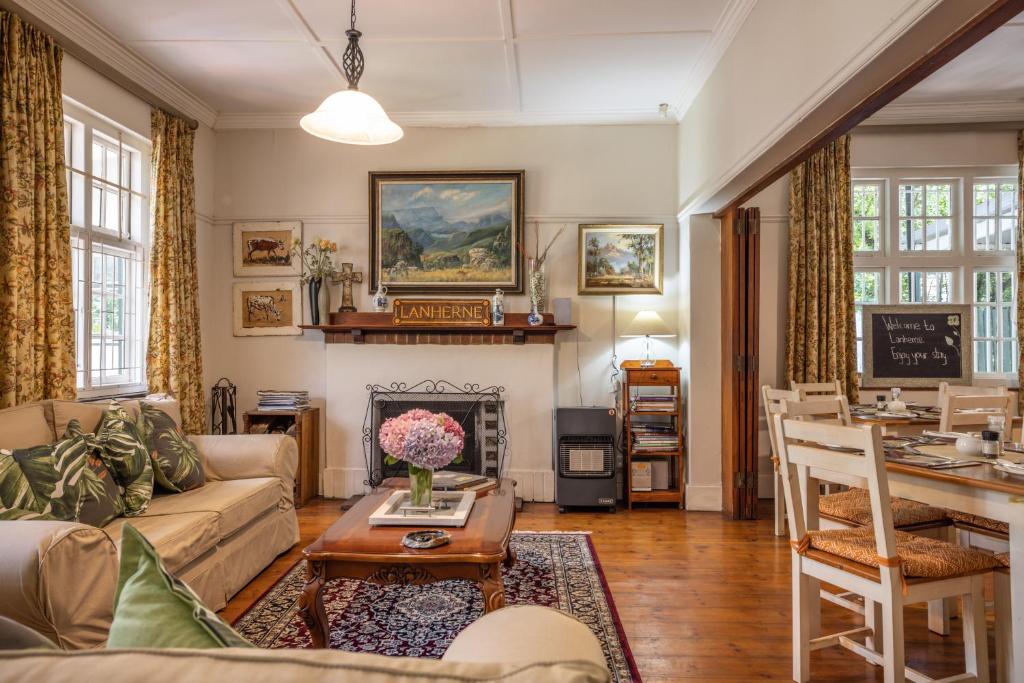 a living room with a couch and a table at Lanherne Guest House Bed & Breakfast in Grahamstown