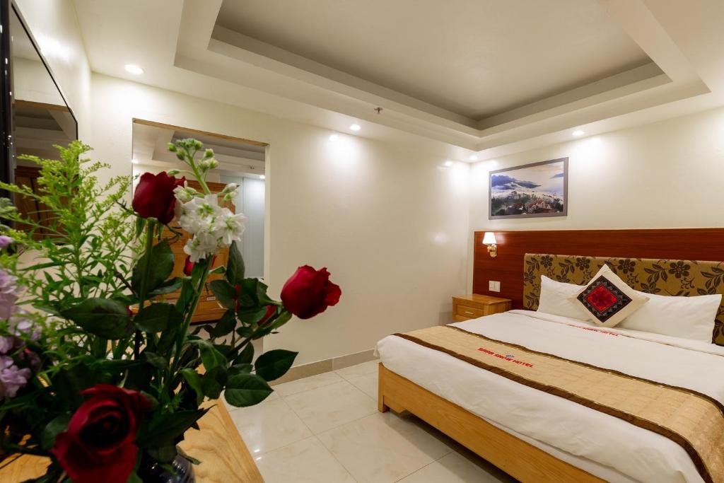Giường trong phòng chung tại Sapa Snow Hotel