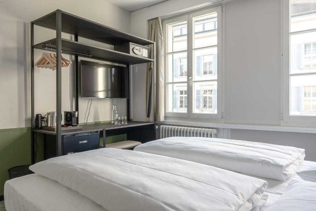 Uma cama ou camas num quarto em Hotel Goldener Stern - contactless check-in