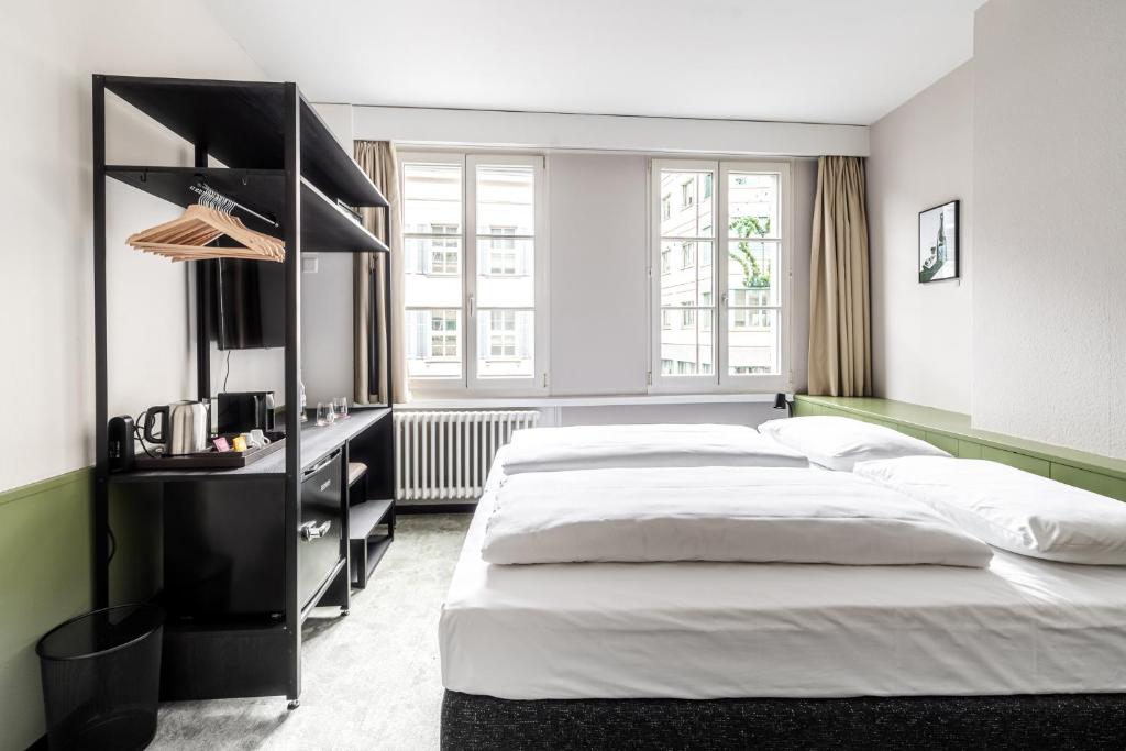 Uma cama ou camas num quarto em Hotel Goldener Stern - contactless check-in