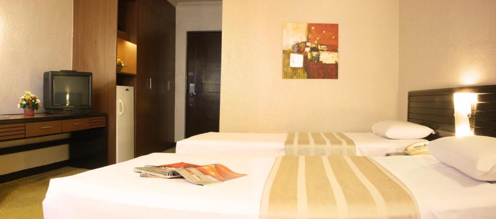 Postel nebo postele na pokoji v ubytování Rothman Hotel