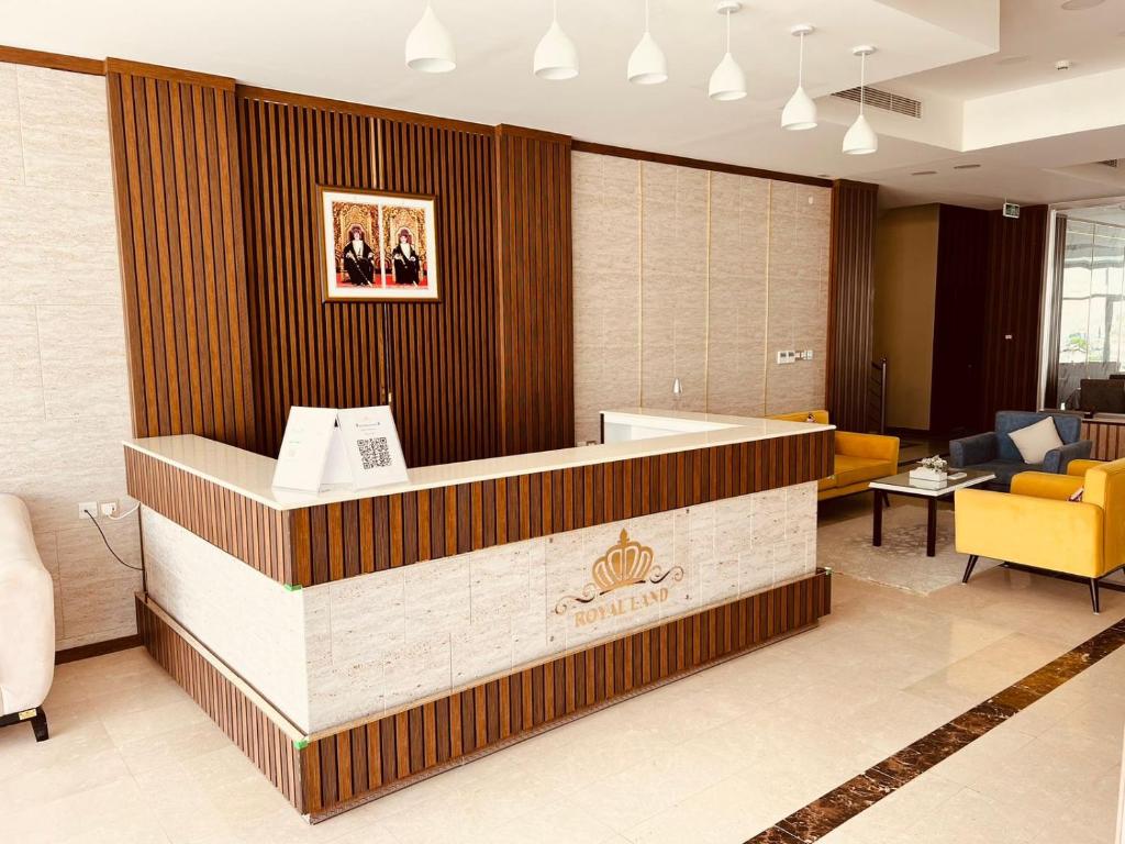 a lobby of a hotel with a reception desk at Royal Land Deluxe Suites رويال لاند للأجنحة الفاخرة in Duqm