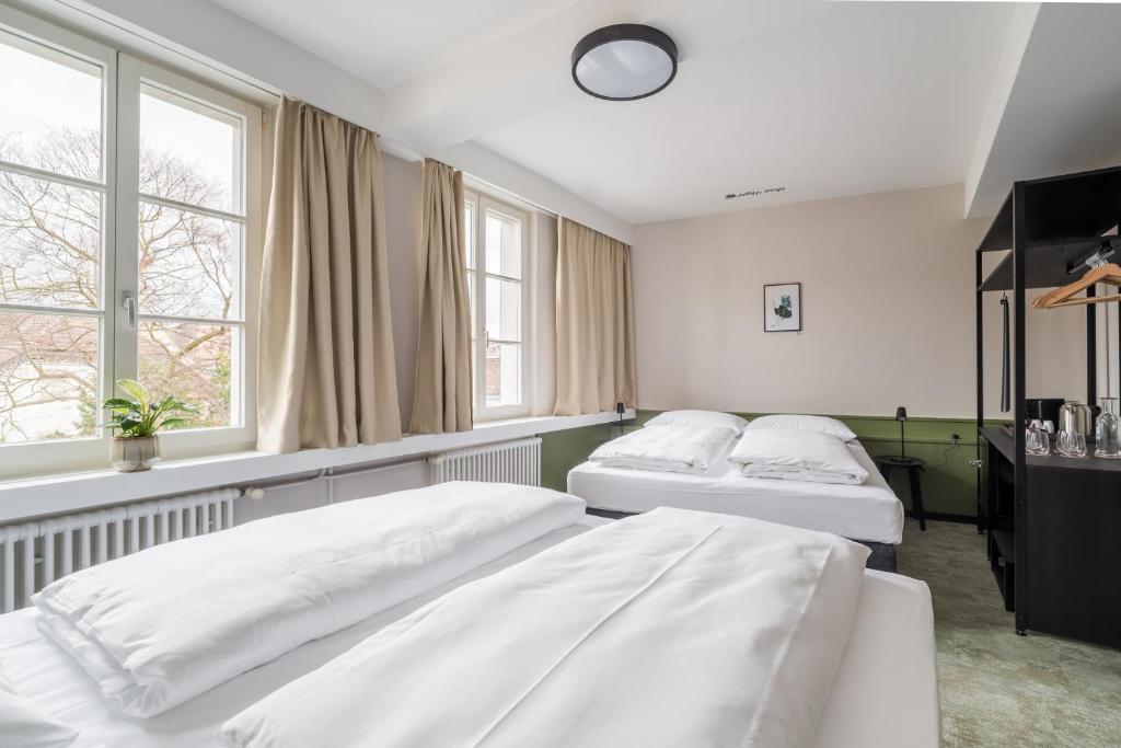Uma cama ou camas num quarto em Hotel Goldener Stern - contactless check-in