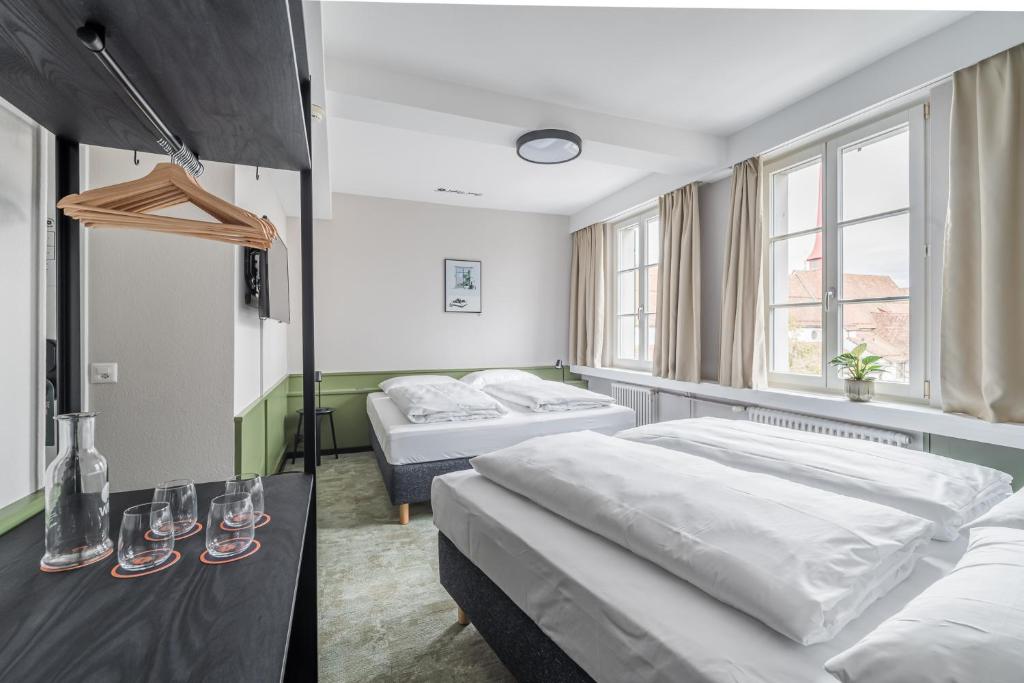 Uma cama ou camas num quarto em Hotel Goldener Stern - contactless check-in