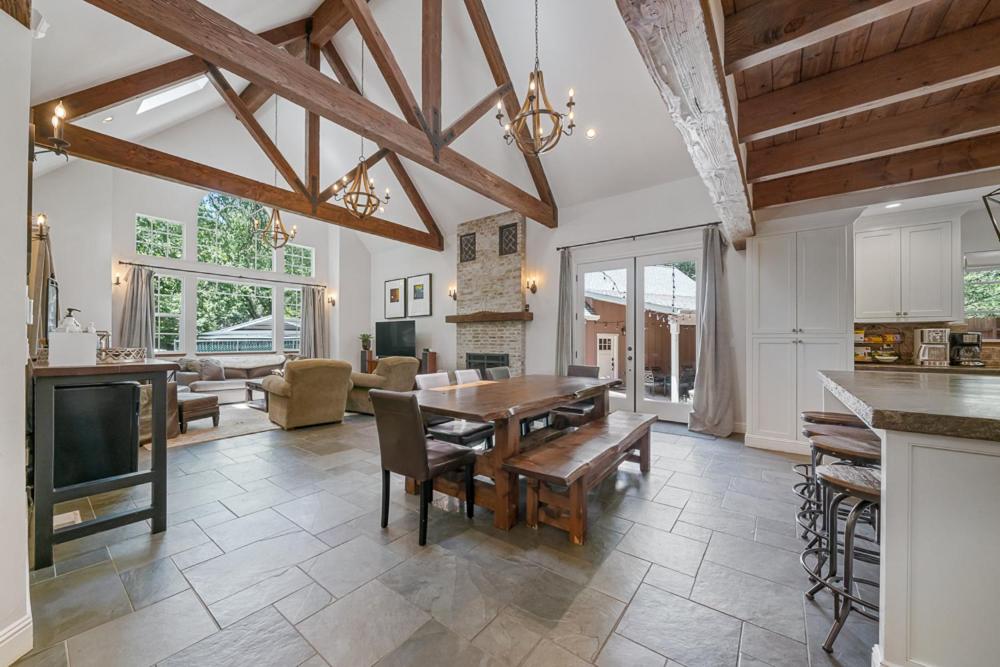 a kitchen and living room with a table and a dining room at Yellowdog Inn in Arnold