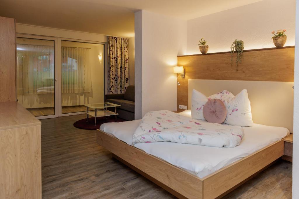 Postel nebo postele na pokoji v ubytování Apartmenthaus Goldeck